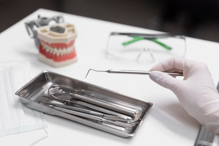 Close up hand holding dental equipment Close up hand holding dental equipment<br />