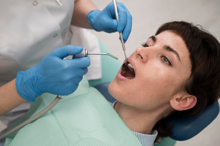 young-female-patient-having-dental-procedure-orthodontist_23-2148985756 Young female patient having dental procedure at the orthodontist<br />